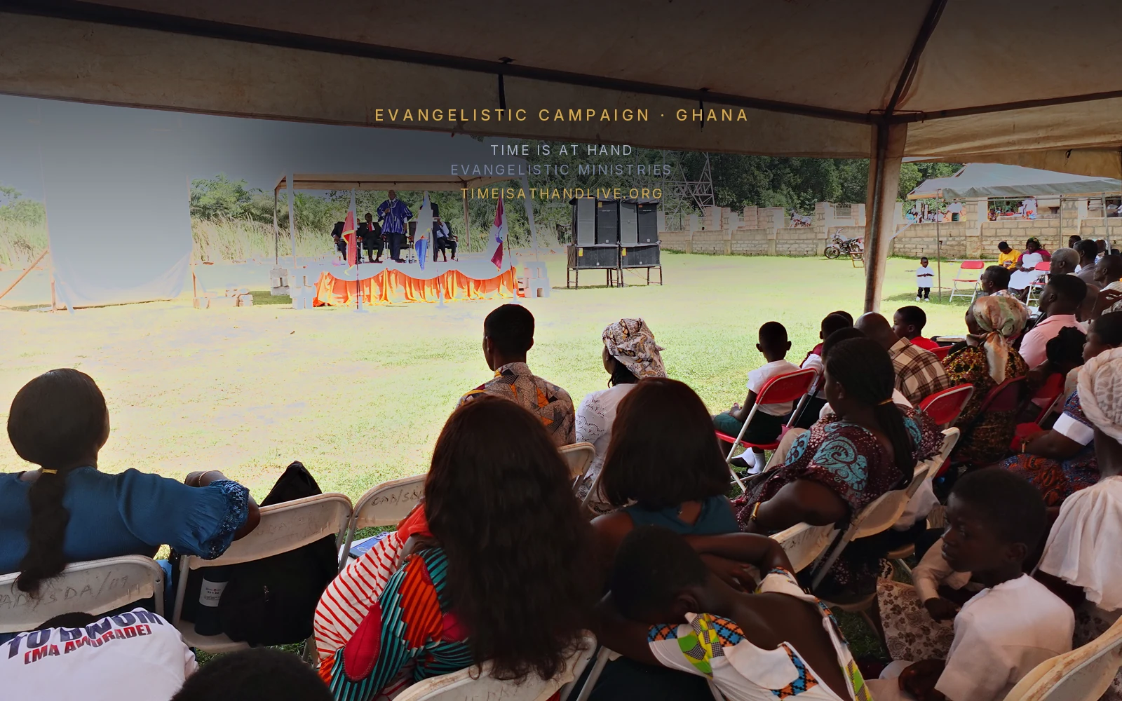 The meeting seen from the back of the tent, the platform across the open ground