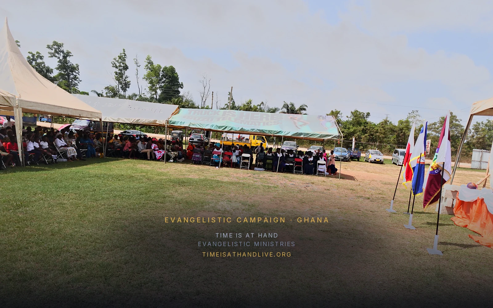 The campaign grounds, tents along the far side and the ministry flags in the foreground