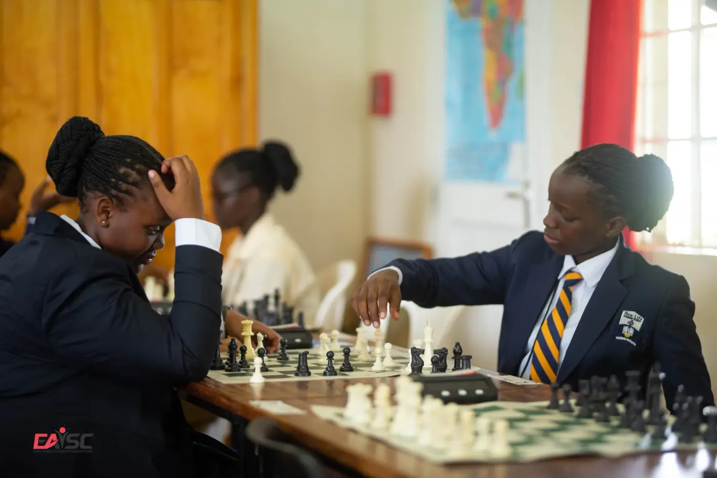 Young people playing chess at a ministry youth activity