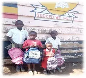 Children outside their school, which the ministry supports