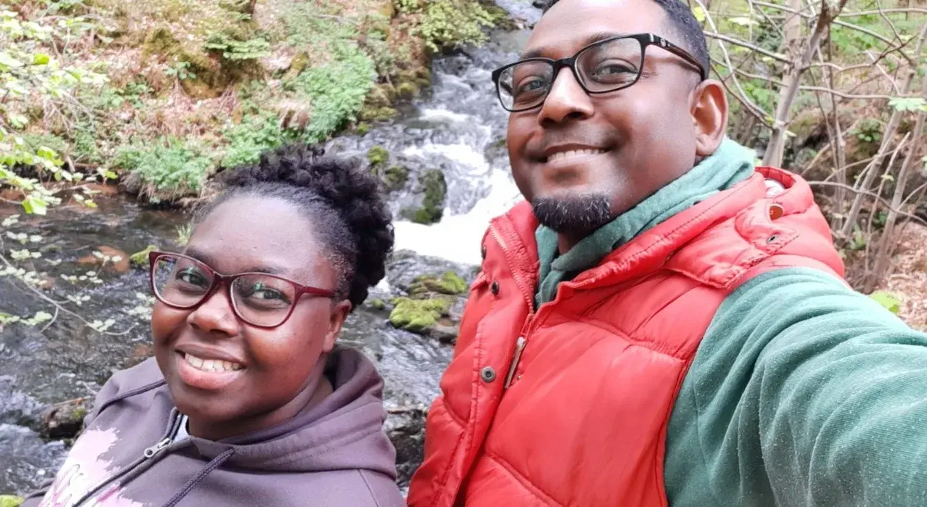 Members of the ministry team beside a stream