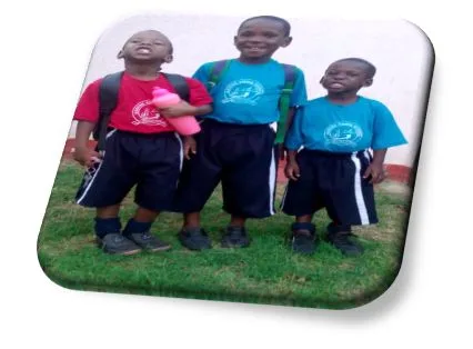 Three children in school uniform supported by the Time Is At Hand orphan programme
